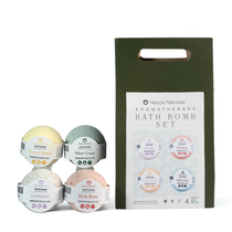 Four bath bombs with a packaging box labeled 'Nazza Naturals Aromatherapy Bath Bomb Set' on a white background.