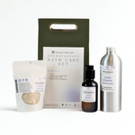 Nezza Naturals Aromatherapy Bath Care Set with Sweet Dreams Bubble bath in aluminum, Sweet Dreams Massage Oil in glass and Lavender Bath Salts in a compostable pouch on a white background