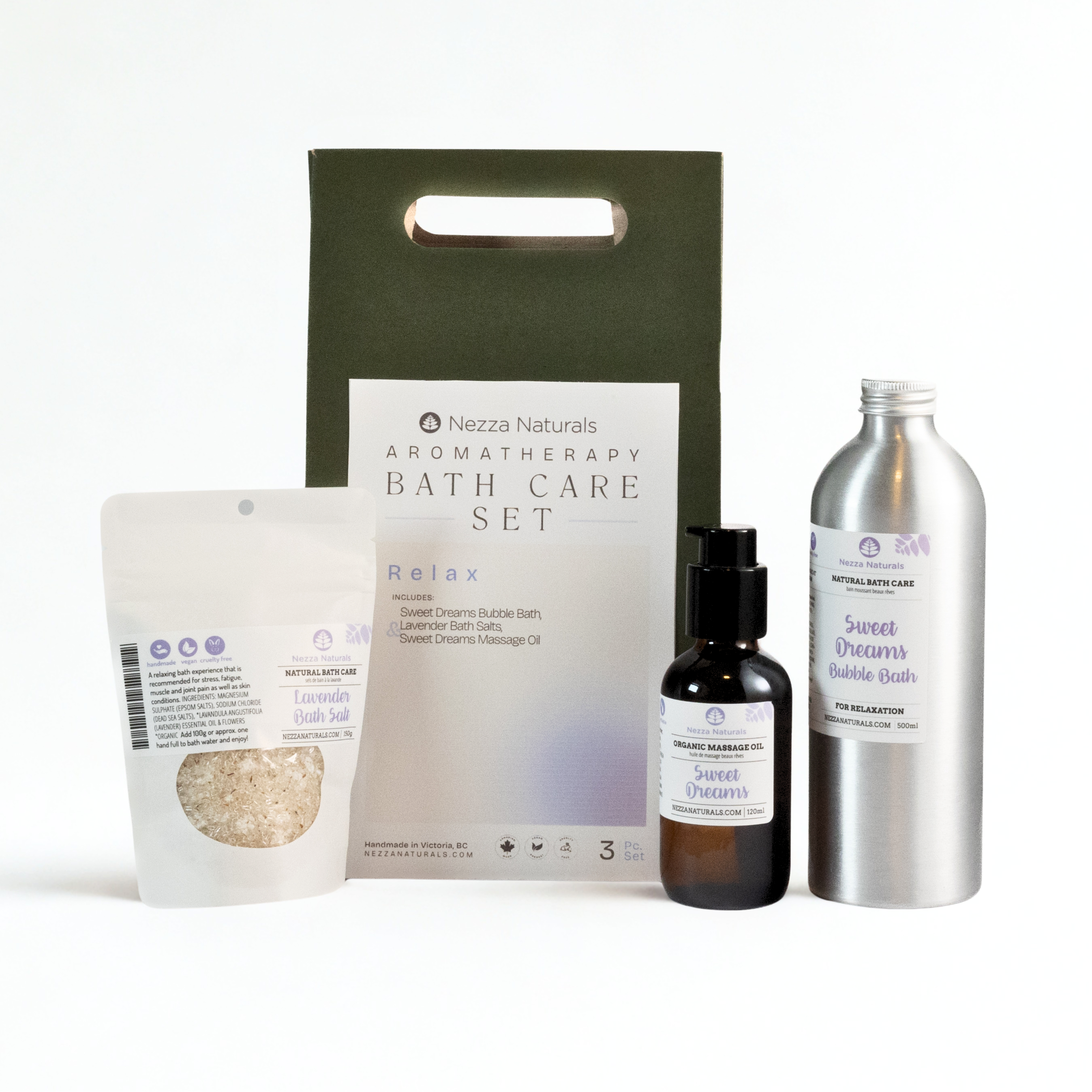 Nezza Naturals Aromatherapy Bath Care Set with Sweet Dreams Bubble bath in aluminum, Sweet Dreams Massage Oil in glass and Lavender Bath Salts in a compostable pouch on a white background