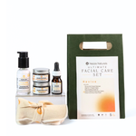 Nezza Naturals Ultimate Facial Care Set with various natural skincare products packaged in glass on a white background